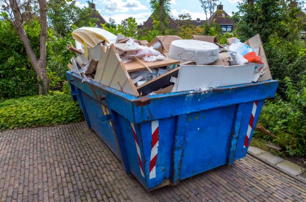 Blue Loaded garbage dumpster